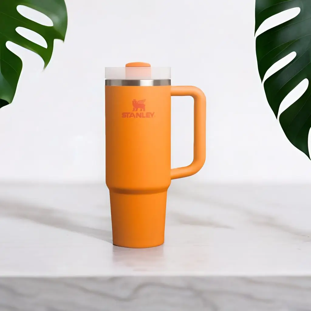 Stanley Flip Straw Tumbler 30 oz in cream color with handle and straw, insulated stainless steel cup for travel and daily hydration