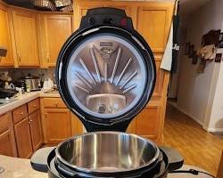 Instant Pot Duo 7-in-1 multi cooker showing control panel and stainless steel pot. Great alternative to a specialized tiger rice cooker.